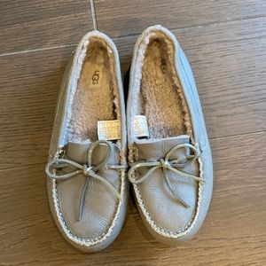 UGGs women’s slipper moccasin with fur inside.